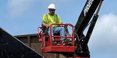 Operator on A-Frame Knuckleboom Loader