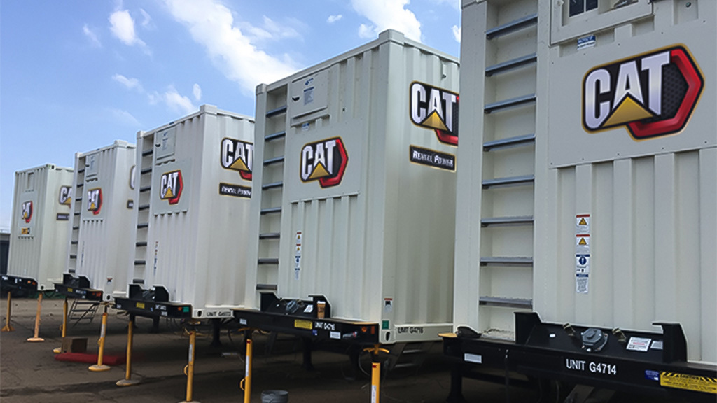 black and white photo of CAT trailers lined up